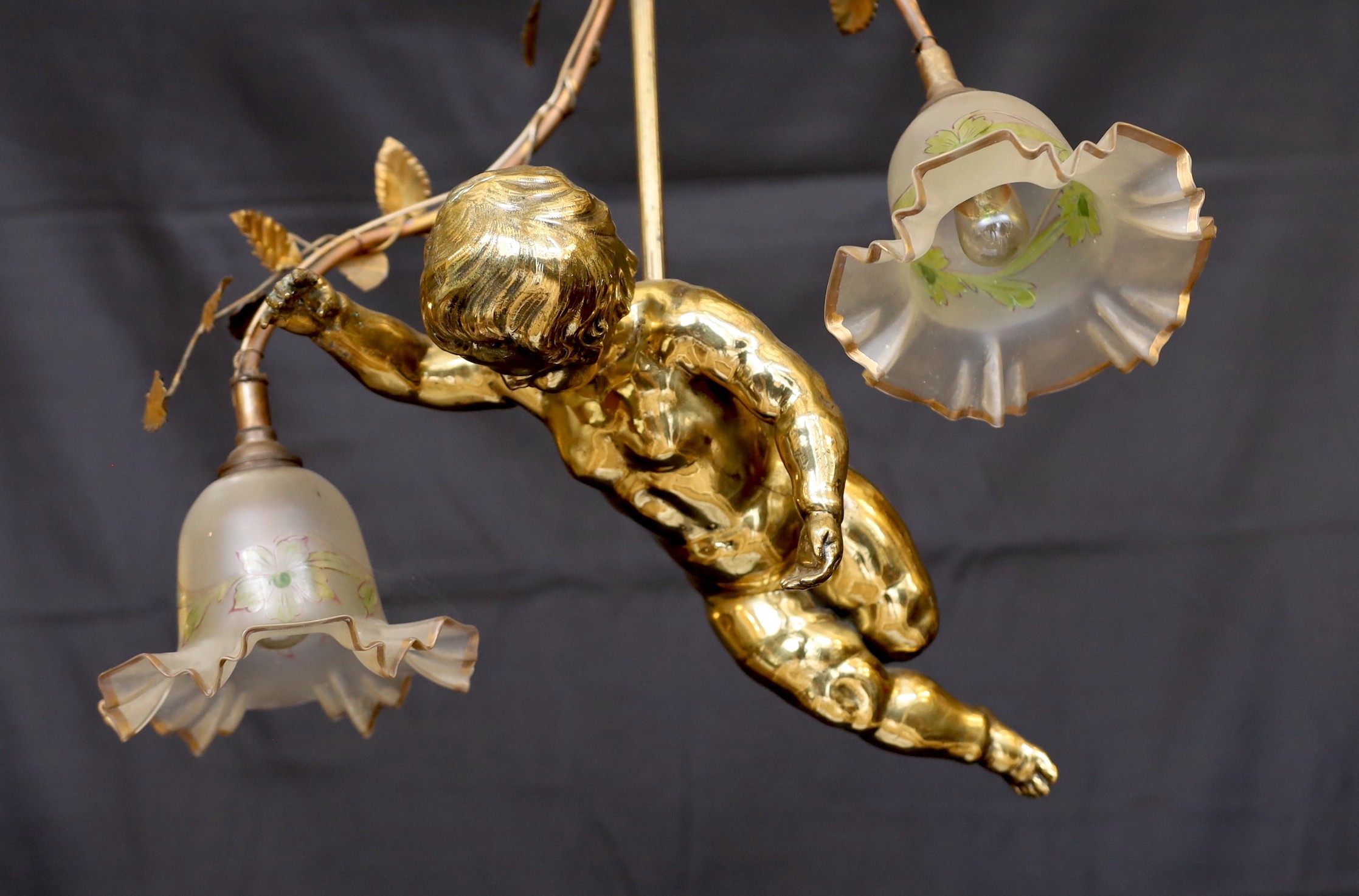A 1920s French gilt bronze and wrought iron ceiling light with putto and rose motifs, drop 71cm. width 44cm